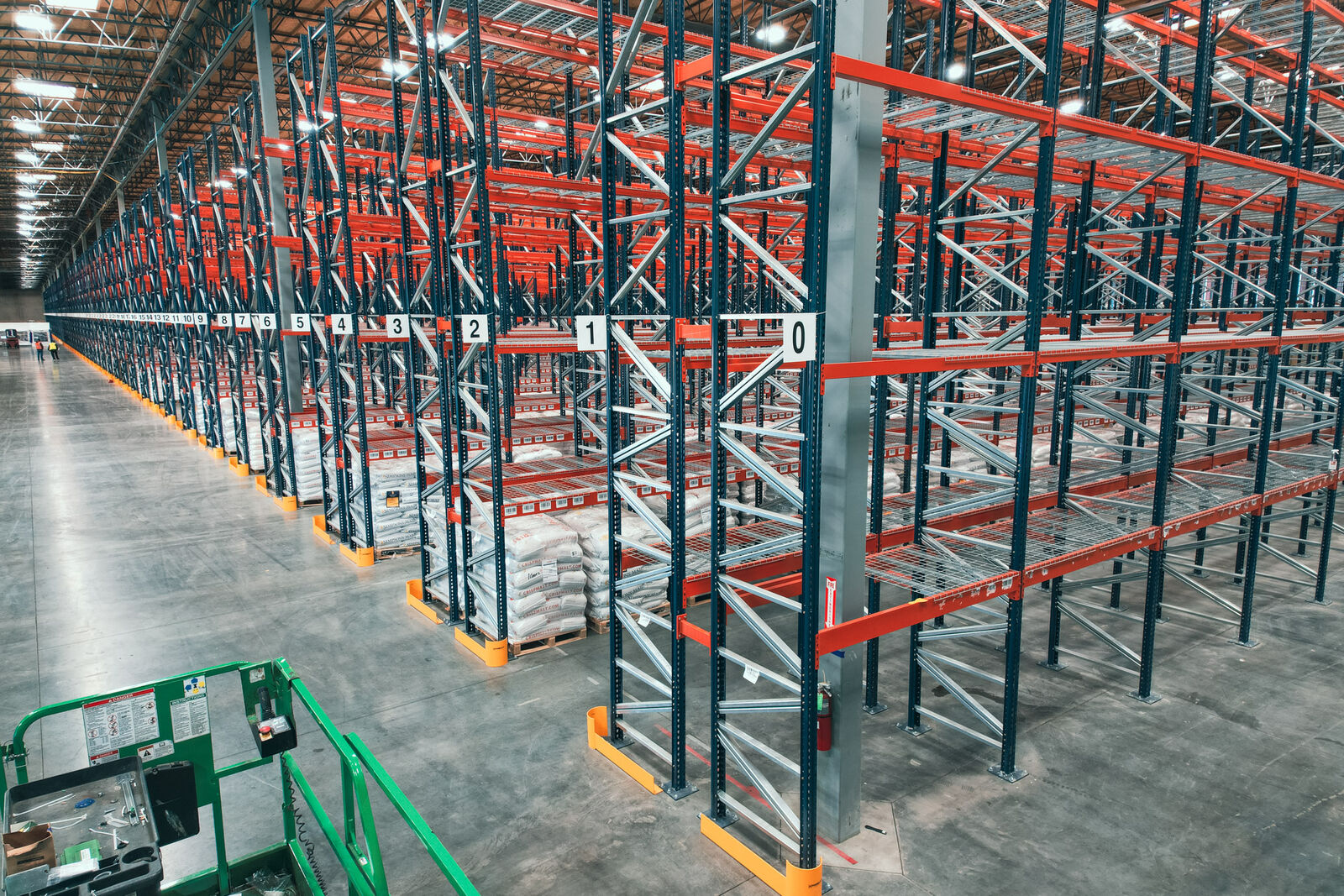 Selective pallet rack row fitted with wire decking on every level