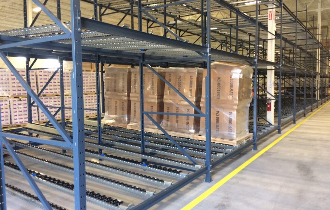 Flow racking system loaded with pallets at the pick face