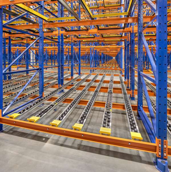 Pallet flow rack lanes with gravity rollers installed